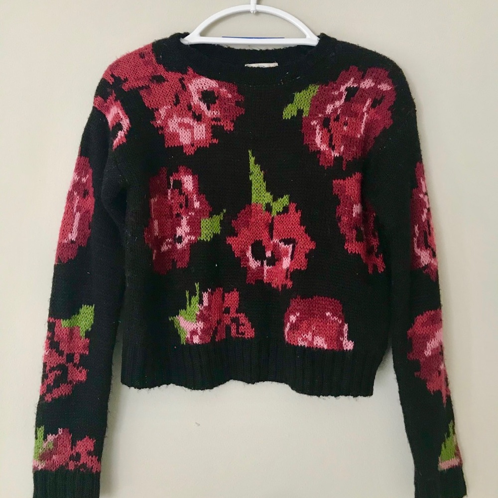 Francesca’s black sweater with roses